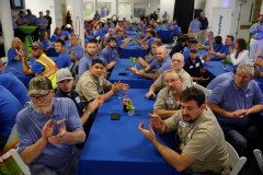 Staff file photo / Workers applaud a speaker during an open house at the Yanfeng Automotive Interiors manufacturing plant in 2017. The company plans to lay off 153 workers in Chattanooga.