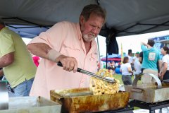 Staff file photo / Randy Carpenter with Family Concessions makes a funnel cake during Chattanooga Taco Festival at Camp Jordan on Saturday, May 4, 2024.