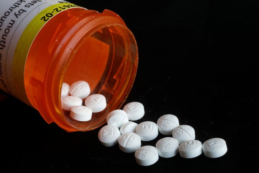 AP File Photo/Mark Lennihan / Pills spill in a photo of prescription Oxycodone in New York.
