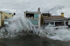 Waves from post-tropical cyclone Rachel crash into beachfront homes in Long Beach, Calif., Monday, Oct. 12, 2026. (AP Photo/Jae C. Hong)
