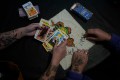 AP File Photo by Natacha Pisarenko / Aldana Mendez holds a set of tarot cards, accompanied by Ana Ottobre, in Villa Carlos Paz, Argentina, Wednesday, July 19, 2023. Both women who identify as spiritual but not religious, feel that tarot guides their life. In the pope's homeland of Argentina, Catholics have been renouncing the faith and joining the growing ranks of the religiously unaffiliated. Commonly known as the 'nones,' they describe themselves as atheists, agnostics or spiritual but not religious.
