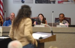Staff File Photo By Matt Hamilton /  School board members look on as Anne Lowery, executive director of Tennessee Stands, speaks in support of the Ten Commandments in public schools during a Hamilton County School Board meeting in October 2026.