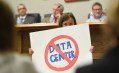 Staff photo by Matt Hamilton / Andrew Bentley's daughter Josie holds a sign during a city council meeting at the Calhoun Depot on Monday, June 8, 2026. Candidates for attorney general in Georgia have had to address questions about data centers.