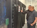 Wiikwemkoong's Chief Technology Officer Michael McCormick, right, and a worker inspect the community's data center in Wiikwemkoong, Ontario, Canada, July 22, 2026. (AP Photo/Kelvin Chan)