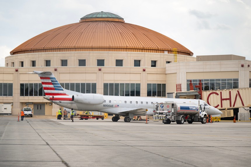 Staff Photo by Seth Carpenter / A refueling truck pulls up beside an American Eagle airplane at the Chattanooga Airport on Oct. 2, 2026. A state aviation study shows the airport and 17 other airports in the region had a $5.2 billion economic impact in 2025, with the Chattanooga facility drawing almost 245,000 visitors, producing a $1.66 billion economic impact.