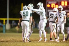 Staff photo by Seth Carpenter / Silverdale Baptist Academy's Ethan Givens (40), center right, celebrates after kicking a field goal during Friday night's TSSAA Division II-AA East Region game at Notre Dame.