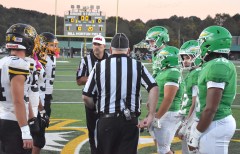 Staff photo by Patrick MacCoon / Players for visiting McMinn County, left, and Rhea County meet at midfield for the coin toss before Friday's TSSAA Region 4-5A matchup in Evensville, Tenn.
