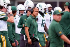 Dave Aranda, center, looks on from the visitors' sideline as he coaches the Baylor University football team during a game at SMU in Dallas on Sept. 6, 2025. (AP Photo/LM Otero)