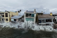 Waves from post-tropical cyclone Rachel crash into beachfront homes in Long Beach, Calif., Monday, Oct. 12, 2026. (AP Photo/Jae C. Hong)