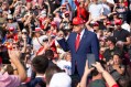 Staff Photo by Seth Carpenter/ President Donald Trump works the crowd as he arrives at a rally for himself at Dalton Municipal Airport on Friday, Oct. 16, 2026.